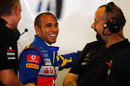 Lewis Hamilton is all smiles in the McLaren garage