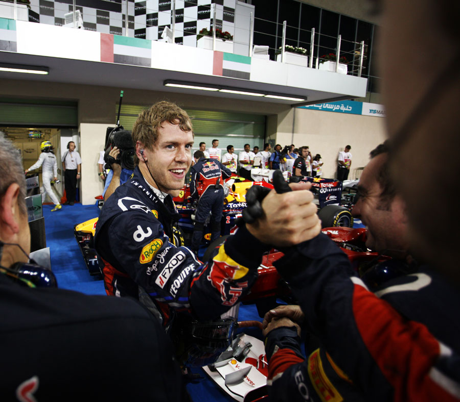 Sebastian Vettel celebrates pole position with his team