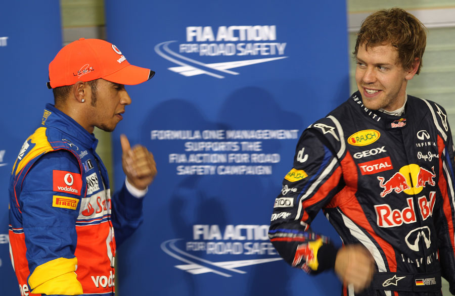 Lewis Hamilton and Sebastian Vettel chat in parc ferme
