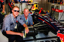 Stuart Broad and Norman Cook enjoy the surroundings of the Red Bull garage