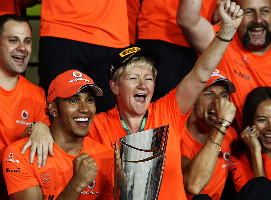 Lewis Hamilton celebrates with his mum Brenda and the rest of the McLaren team