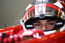 Jules Bianchi sits in the cockpit of the Ferrari between runs