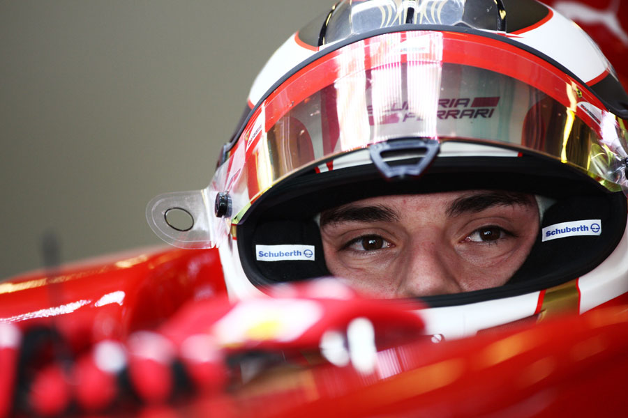 Jules Bianchi sits in the cockpit of the Ferrari between runs