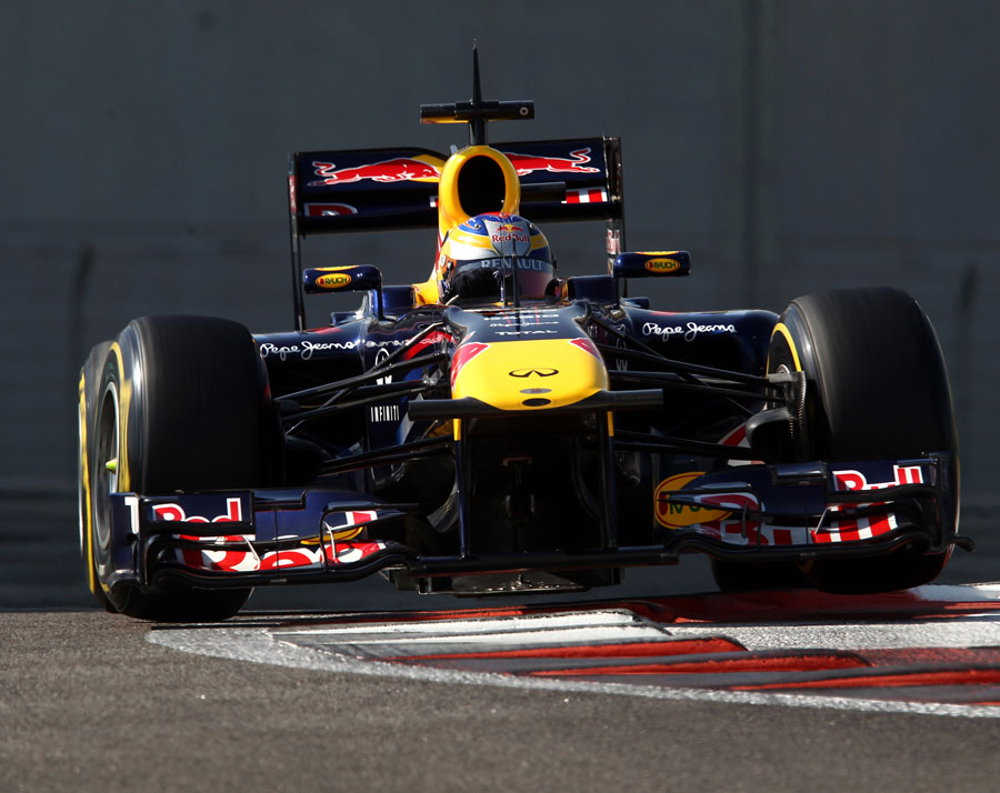 Jean-Eric Vergne attacks the kerbs in the Red Bull