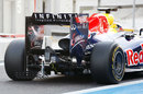 Jean-Eric Vergne heads down the pit lane with a measuring device on the rear of the RB7