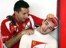 Jules Bianchi receives treatment on his neck in the Ferrari garage