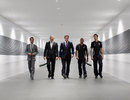 British Prime Minister David Cameron with Mark Cavendish, Ron Dennis, Jenson Button and Lewis Hamilton during a visit to the McLaren Technology Centre
