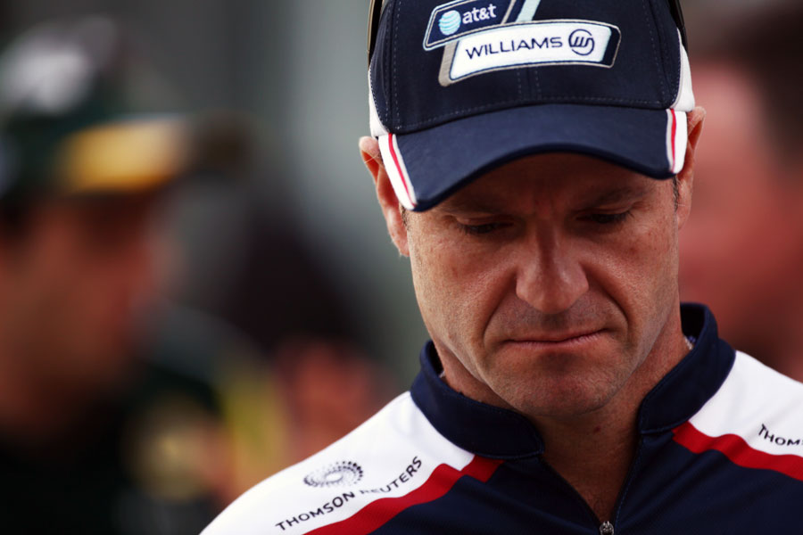 Rubens Barrichello walks to the drivers' parade