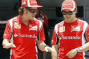Fernando Alonso and Felipe Massa chat in the paddock