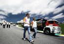 Paul di Resta and Nico Hulkenberg walk the track