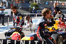 Mark Webber and Sebastian Vettel wait for a Red Bull end of season photoshoot