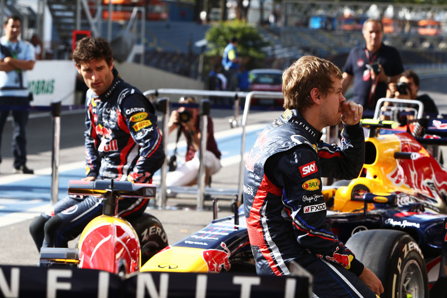 Mark Webber and Sebastian Vettel wait for a Red Bull end of season photoshoot