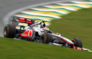 Jenson Button speeds downhill on soft tyres