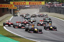 Sebastian Vettel leads the grid into the first corner