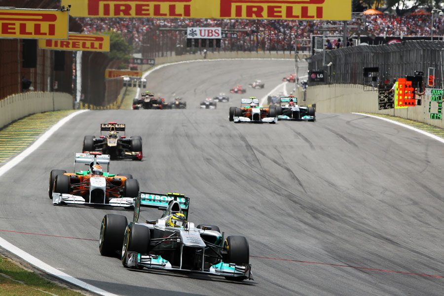 Nico Rosberg holds off Adrian Sutil into turn one