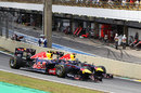 Mark Webber passes Sebastian Vettel into turn one to take the lead