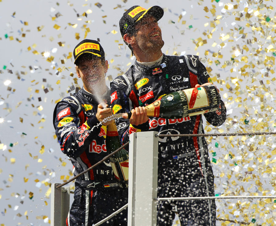 Mark Webber and Sebastian Vettel celebrate a Red Bull one-two on the podium