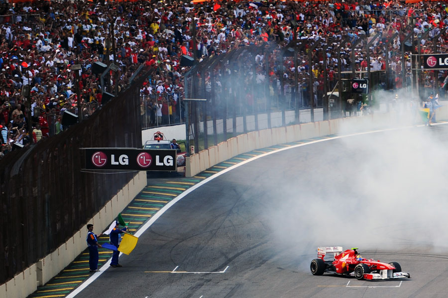 Felipe Massa entertains his home crowd with some donuts after the race