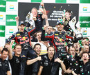 Mark Webber and Sebastian Vettel celebrate a Red Bull one-two with the team on the podium