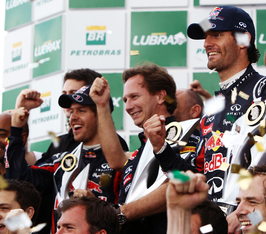 Mark Webber, Christian Horner and Sebastian Vettel celebrate a Red Bull one-two on the podium
