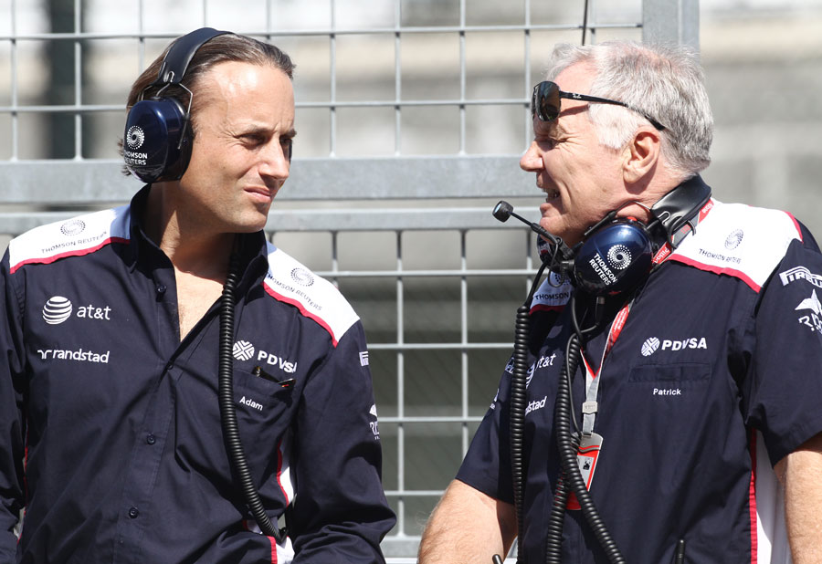 Patrick Head in discussion with Adam Parr on the pit wall