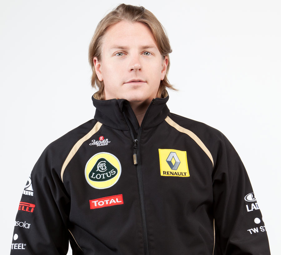 Kimi Raikkonen poses in his new Lotus Renault team kit