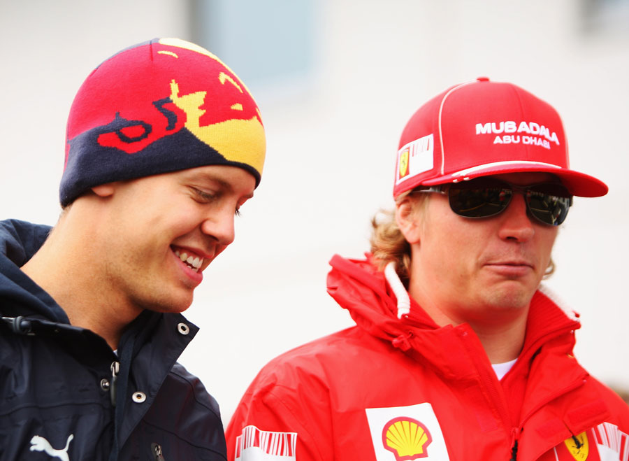 Sebastian Vettel and Kimi Raikkonen in the paddock