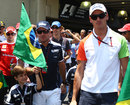 Rubens Barrichello and Adrian Sutil on their way to the drivers' parade