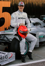 Michael Schumacher sits on the car he will make his F1 return in
