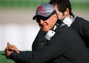 Michael Schumacher, who is due to take to the track this afternoon, watches testing