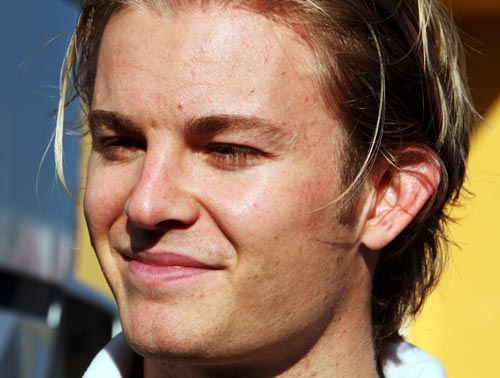 Nico Rosberg hands over the Mercedes to Michael Schumacher