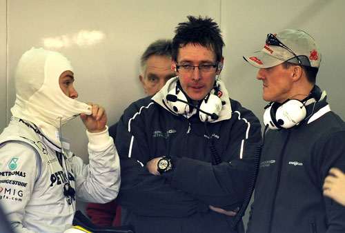 Nico Rosberg and Michael Schumacher talk with race engineer Andy Shovlin