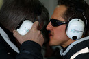 Michael Schumacher has a word with Ross Brawn