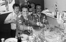 Niki Lauda celebrates his first title alongside team-mate and race winner Clay Regazzoni
