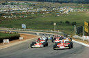 Niki Lauda leads James Hunt on the formation lap