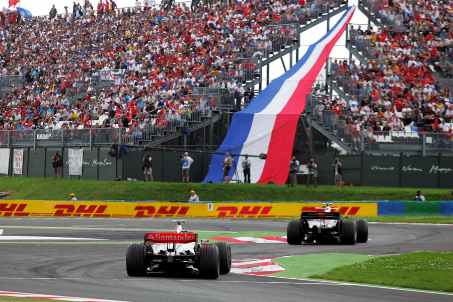 Lewis Hamilton follows a Red Bull through the final chicane