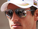 Adrian Sutil faces the media in the paddock