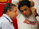 Jean Todt talks to Felipe Massa at the back of the garage