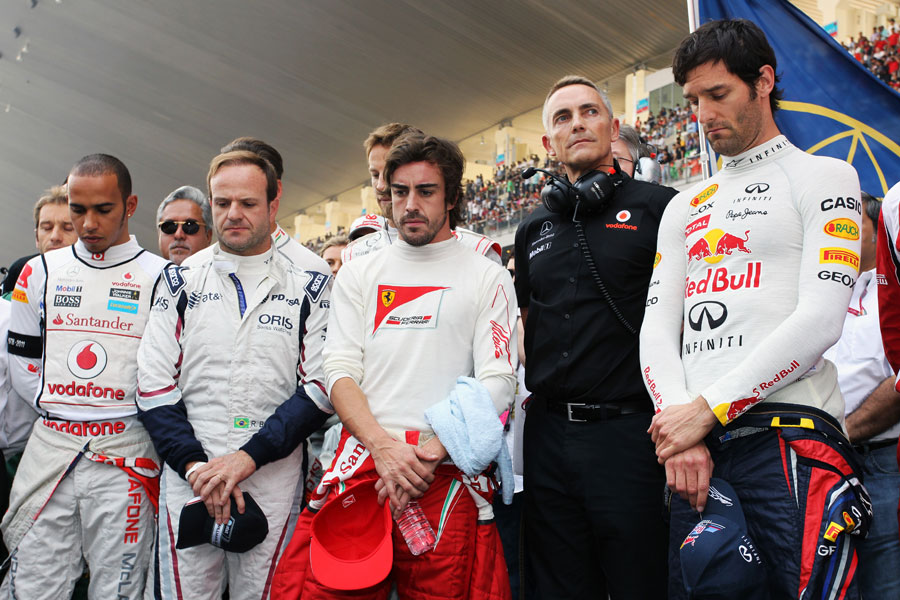 The drivers and team principals observe a minute's silence in memory of Dan Wheldon and Marco Simoncelli