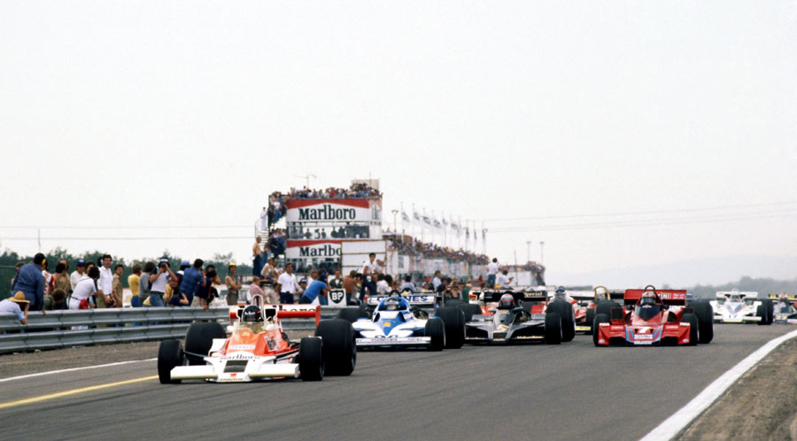 James Hunt leads away from Jacques Laffite at the start of the race with Mario Andretti and John Watson side-by-side behind