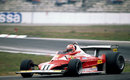 Niki Lauda gets the power down in his Ferrari
