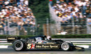 Mario Andretti speeds past the crowd on his way to victory