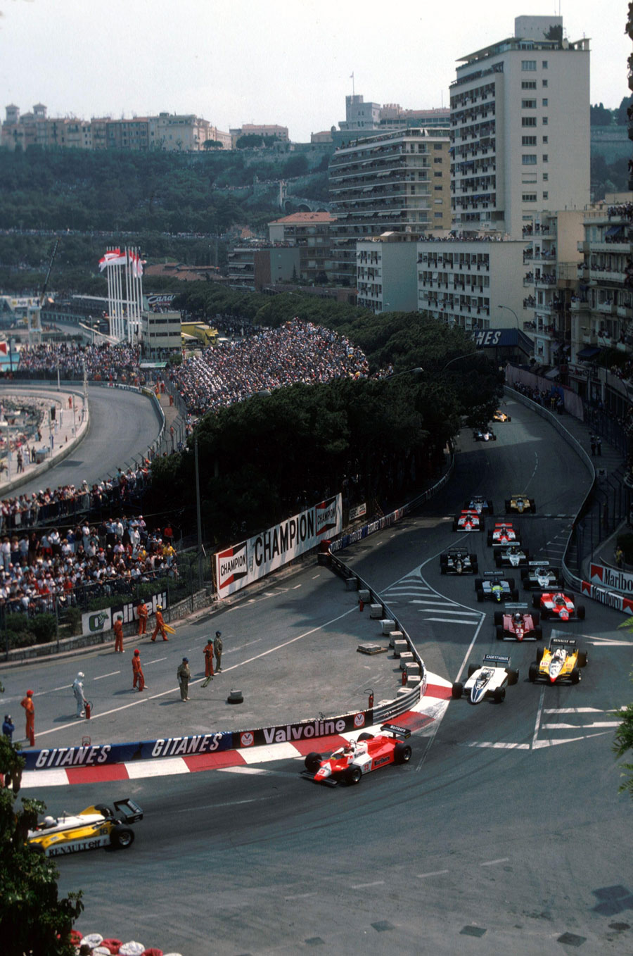 Rene Arnoux leads Bruno Giacomelli and Riccardo Patrese through the first corner with Alain Prost in fourth place
