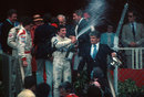 Riccardo Patrese celebrates his first grand prix victory on the podium