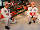 Lewis Hamilton and Jenson Button pose with the new McLaren MP4-27
