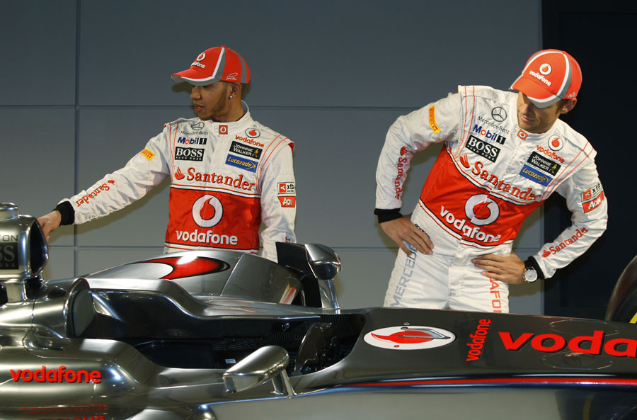 Lewis Hamilton and Jenson Button inspect the new car