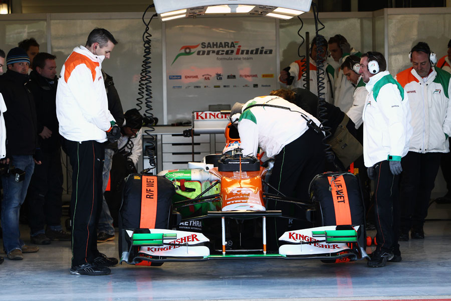Paul di Resta is strapped in before taking to the track in the Force India VJM05