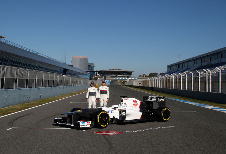 Kamui Kobayashi and Sergio Perez pose with the new Sauber C31