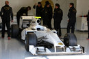 HRT's 2011 car - the F111 - in the garage in Jerez
