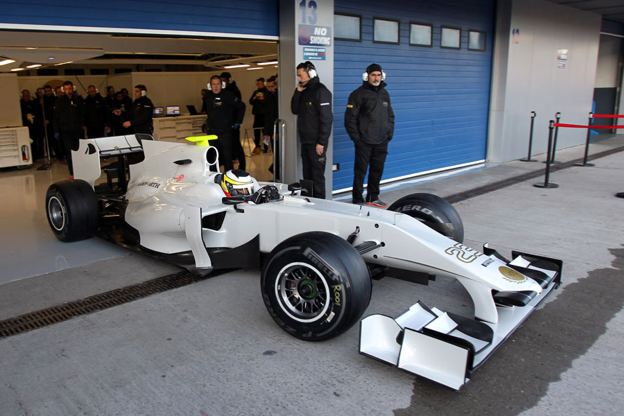 Pedro de la Rosa leaves the HRT garage in the 2011 car
